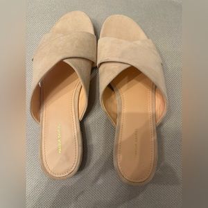 Beige suede slide sandals by Mansur Gavriel.